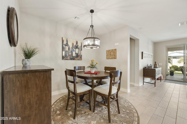 dining room featuring a notable chandelier