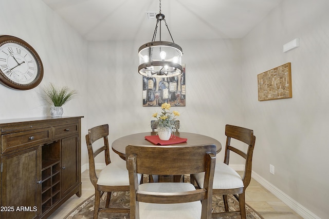 dining room featuring a notable chandelier