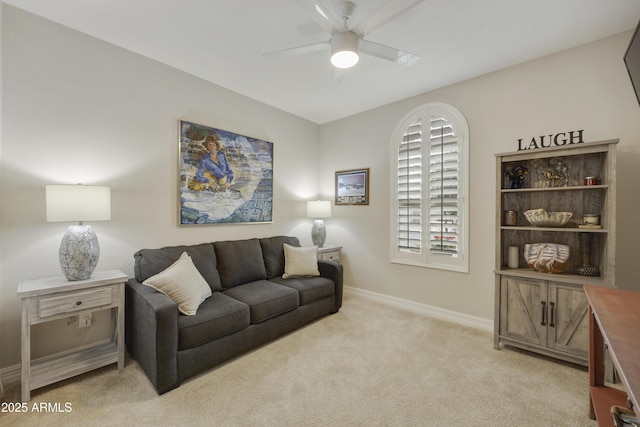 living room with light carpet and ceiling fan