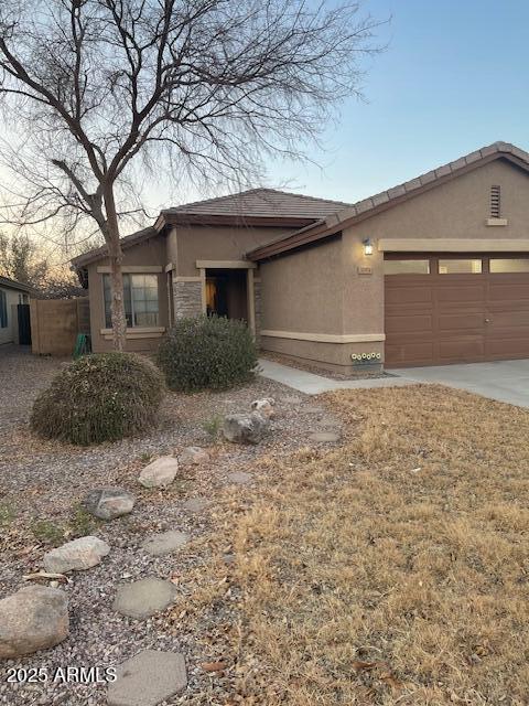 view of front of property featuring a garage