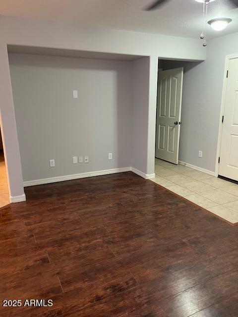 unfurnished room with wood-type flooring