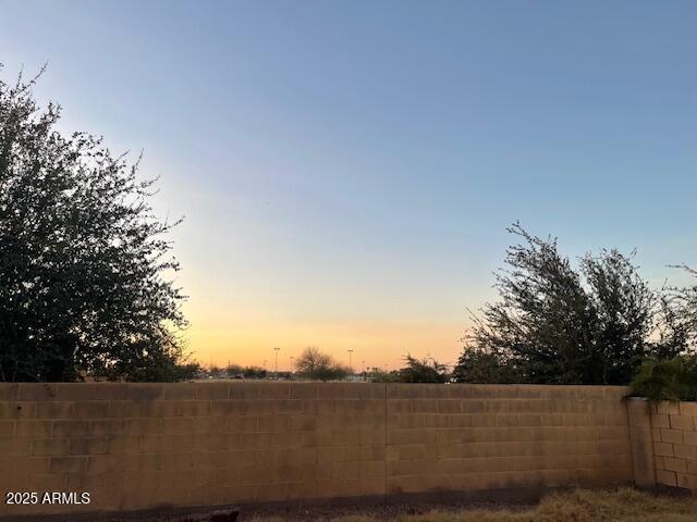 view of yard at dusk