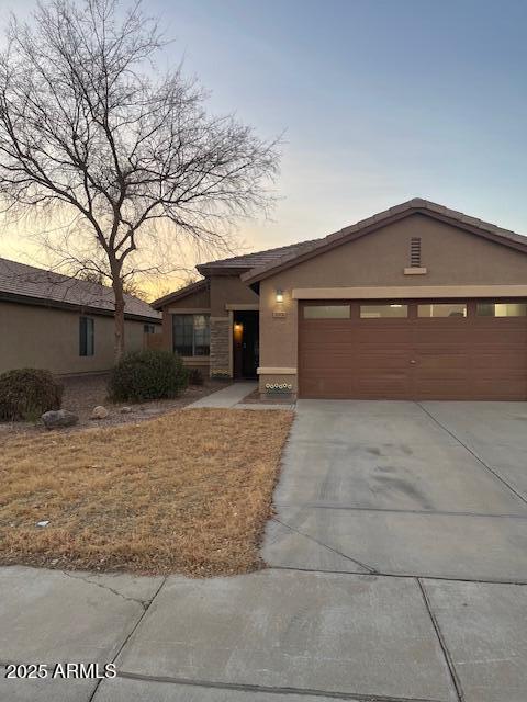 single story home featuring a garage