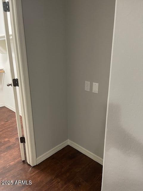 spare room with dark hardwood / wood-style flooring