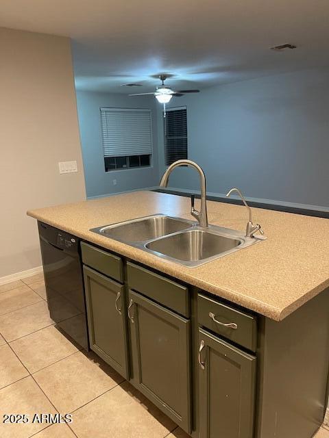 kitchen featuring sink, ceiling fan, dishwasher, an island with sink, and light tile patterned flooring