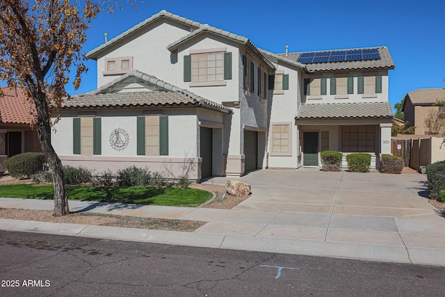 view of front facade with solar panels