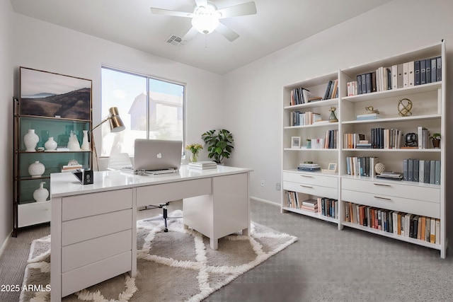 office featuring carpet and ceiling fan