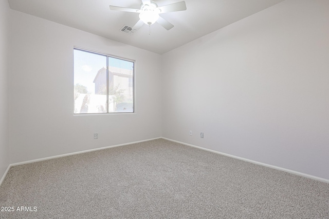 spare room with carpet flooring and ceiling fan