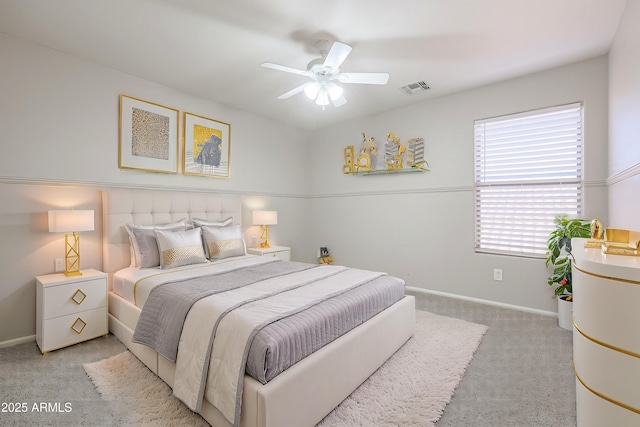 bedroom featuring ceiling fan and light colored carpet