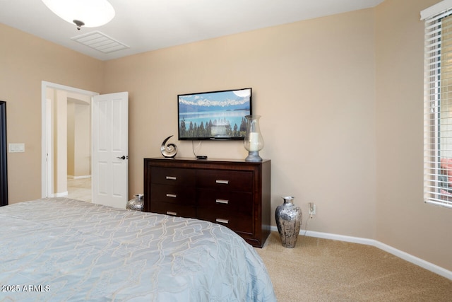 bedroom featuring visible vents, carpet flooring, and baseboards