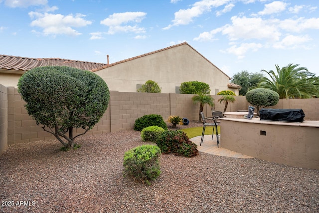 view of yard featuring a patio and a fenced backyard