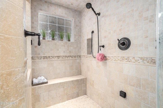 full bathroom with tiled shower