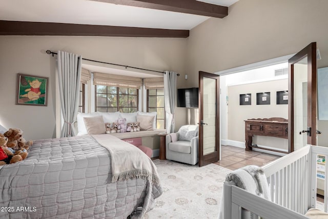 bedroom with lofted ceiling with beams, french doors, light tile patterned floors, and visible vents