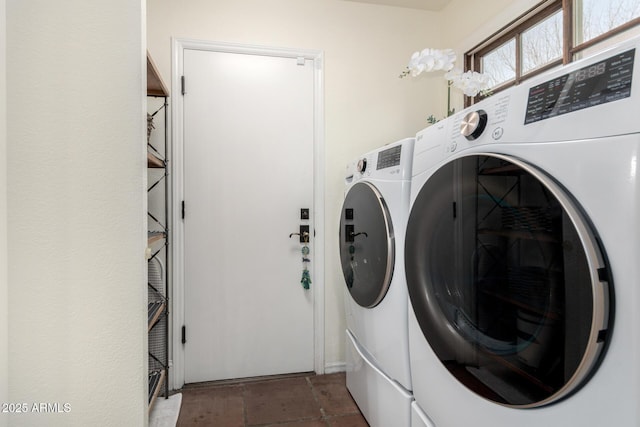 laundry area with laundry area and washer and dryer