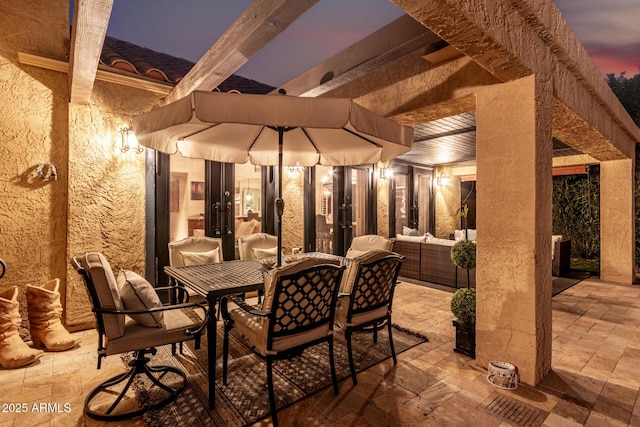 view of patio featuring outdoor dining space and an outdoor living space