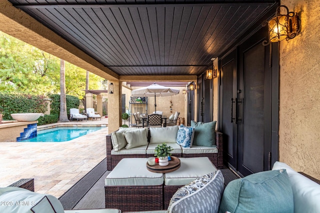 view of patio featuring an outdoor hangout area, outdoor dining space, and a fenced in pool