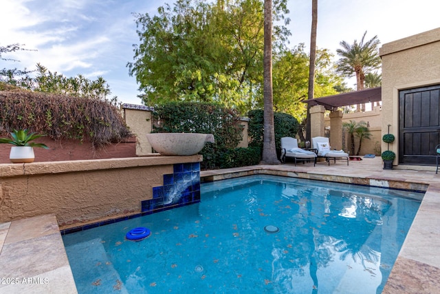 view of pool featuring a patio area and fence