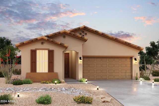 mediterranean / spanish-style home featuring a garage