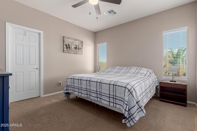 bedroom featuring visible vents, carpet flooring, a ceiling fan, and baseboards