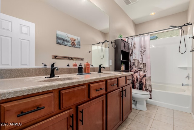 full bath featuring tile patterned floors, toilet, double vanity, and a sink