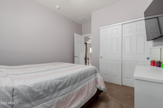 carpeted bedroom with a closet