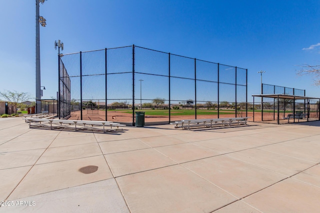 view of community with fence