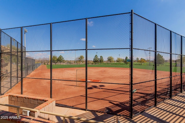 view of home's community featuring fence