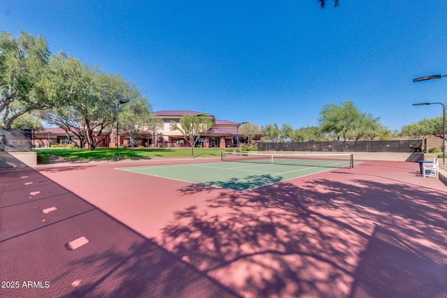 view of sport court with fence