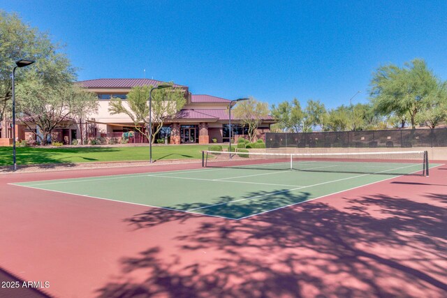 view of sport court featuring a lawn, community basketball court, and fence