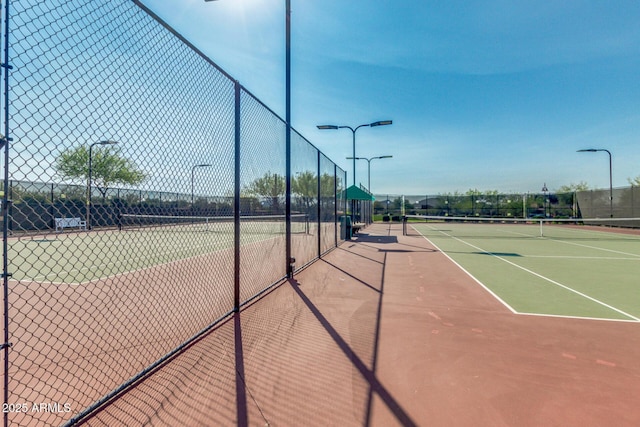 view of sport court with community basketball court and fence