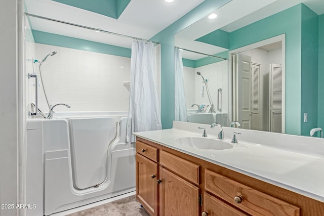full bathroom with recessed lighting and vanity