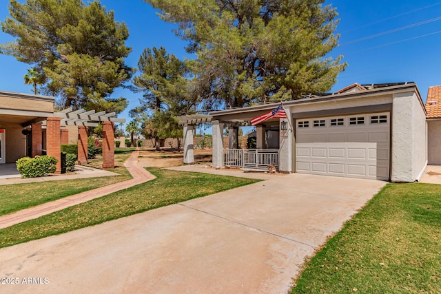 view of front of house with covered porch, driveway, a front yard, an attached garage, and stucco siding