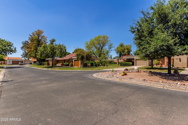 view of road featuring curbs and a residential view