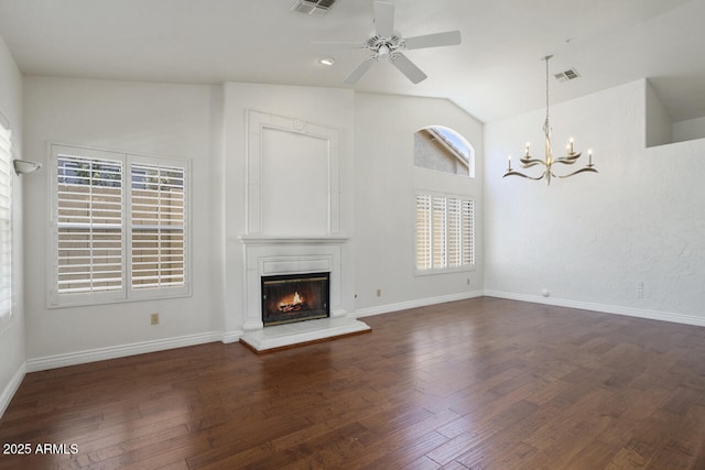 19102 N 91st St, Scottsdale, AZ 85255 - unfurnished living room with ceiling fan, a chandelier, a glass covered fireplace, healthy amount of natural light, and lofted ceiling