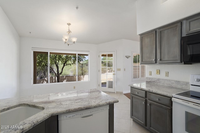 19102 N 91st St, Scottsdale, AZ 85255 - kitchen with white appliances, a chandelier, and light stone counters