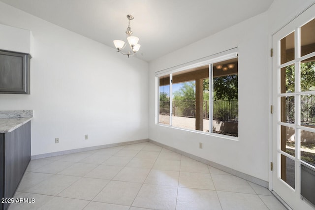 19102 N 91st St, Scottsdale, AZ 85255 - unfurnished dining area featuring a chandelier, healthy amount of natural light, and light tile patterned floors