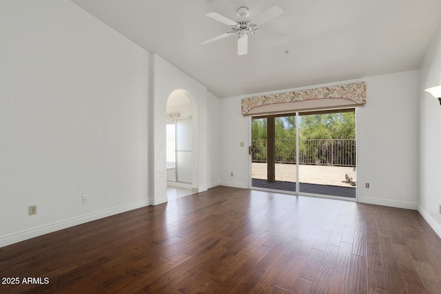 19102 N 91st St, Scottsdale, AZ 85255 - empty room with plenty of natural light, arched walkways, a ceiling fan, dark wood-style flooring, and high vaulted ceiling