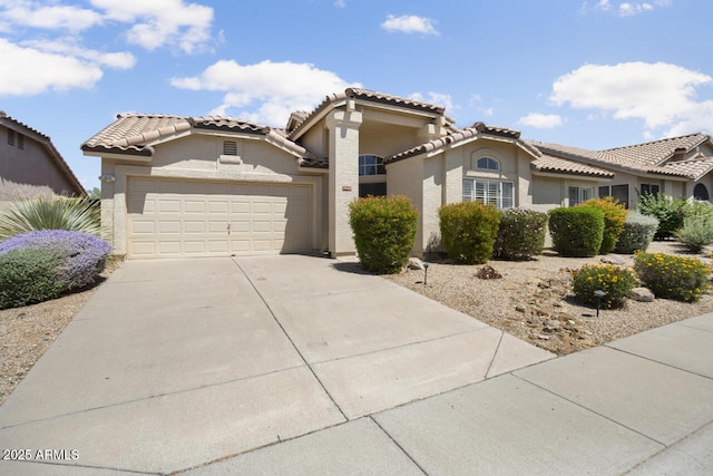 19102 N 91st St, Scottsdale, AZ 85255 - mediterranean / spanish home with a garage, concrete driveway, a tiled roof, and stucco siding