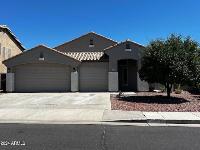 view of front of property with a garage