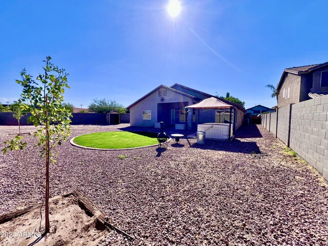 back of property featuring a lawn and a patio area