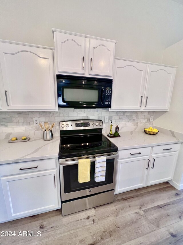 kitchen with light hardwood / wood-style floors, white cabinetry, and stainless steel range with electric cooktop