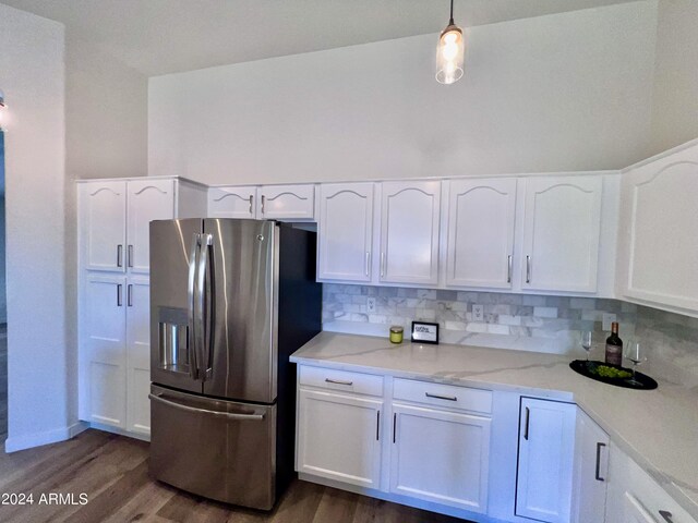 kitchen with hanging light fixtures, dark hardwood / wood-style floors, white cabinets, and stainless steel refrigerator with ice dispenser