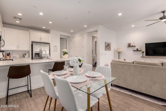 dining room featuring recessed lighting, light wood-style flooring, and ceiling fan