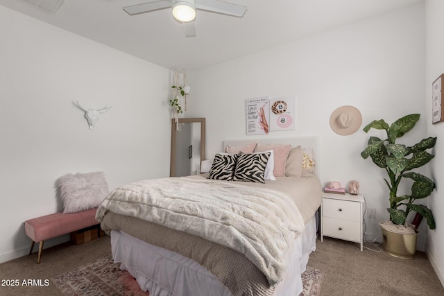 carpeted bedroom with baseboards and a ceiling fan