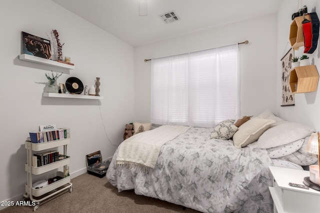 carpeted bedroom featuring baseboards