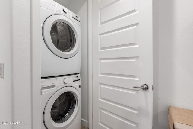 laundry room featuring stacked washer / dryer