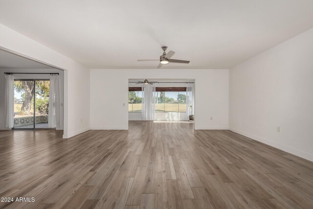 spare room with hardwood / wood-style flooring and ceiling fan