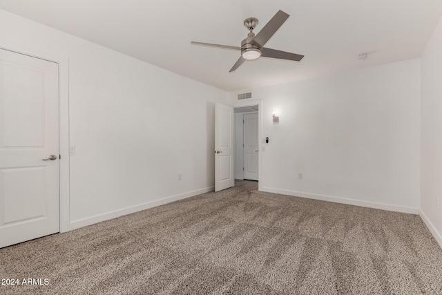 spare room with carpet flooring and ceiling fan