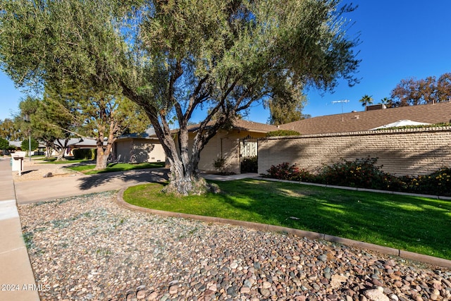 view of property exterior featuring a lawn