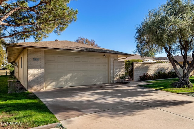 ranch-style home featuring an outbuilding